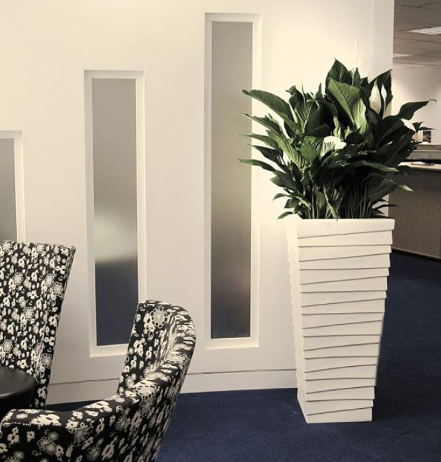 Groovy tall square Stack container with Spathyfyllum plant in this Nottingham office Breakout area