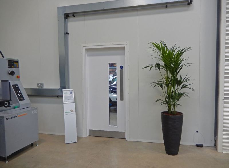 Tall Curved Vase with a Kentia Palm plant for this Nottingham factory HQ offices showroom